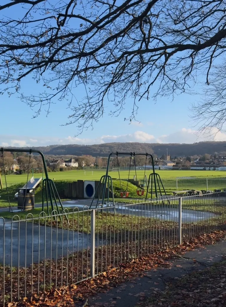 Playground equipment on the War Memorial Recreation Ground on a sunny day.