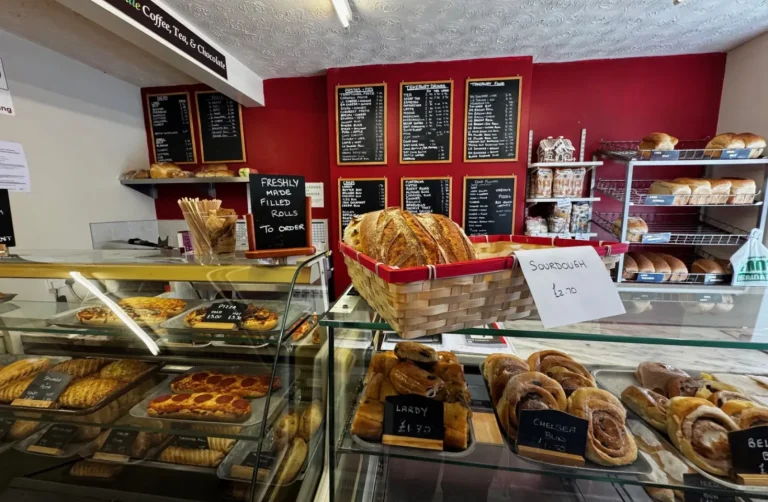 Freshly baked goods, including bread and cakes on the counter inside the Traditional Bakery shop.